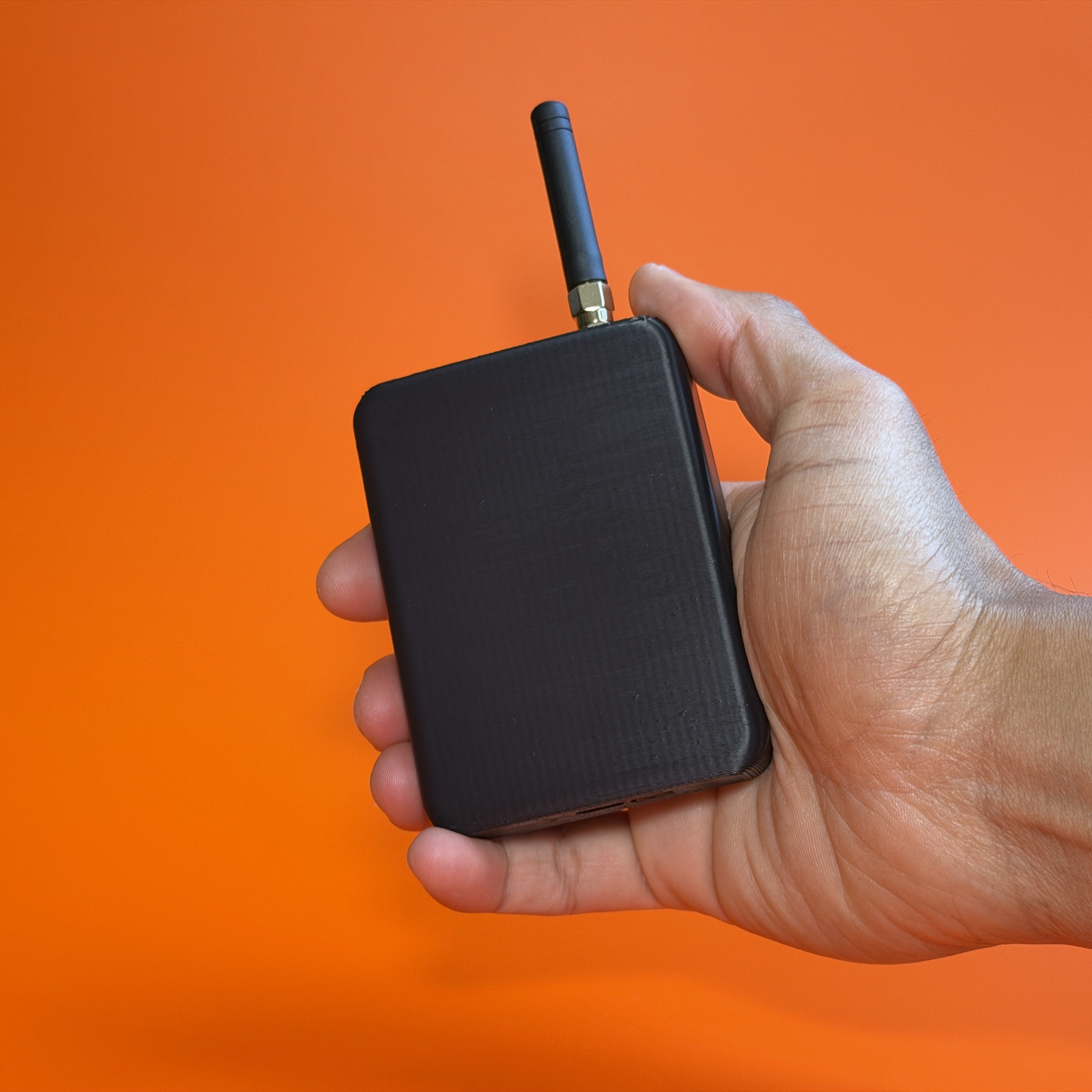 Beacon 2 held in hand, showing its pocketable size