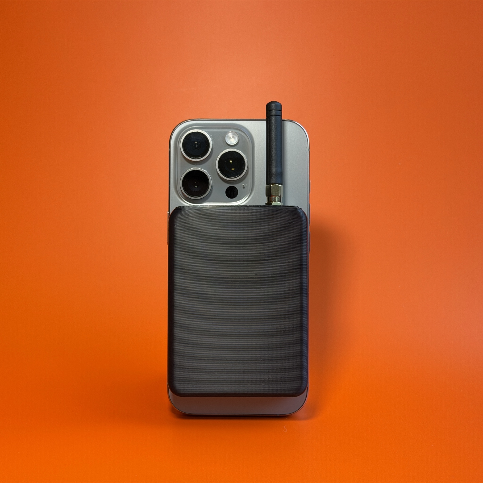 Beacon 2 snapped to the back of an iPhone with its MagSafe magnet ring